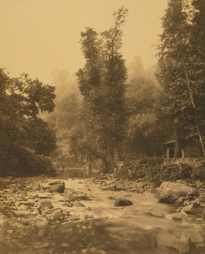 Paysage avec une rivière et un moulin_0