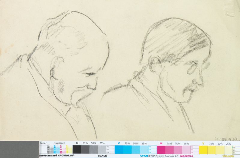 Profils d'un homme barbu et d'un homme à lunettes regardant vers le sol_0