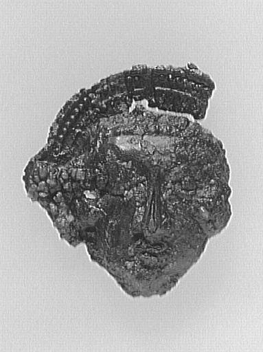 FRAGMENT D'ENSEIGNE DE PELERINAGE : TETE D'HOMME NIMBEE_0