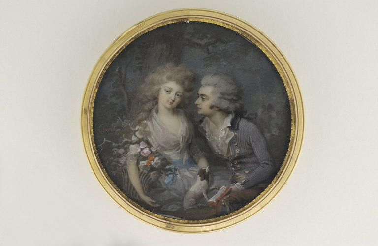 Jeune homme et jeune femme dans un parc_0