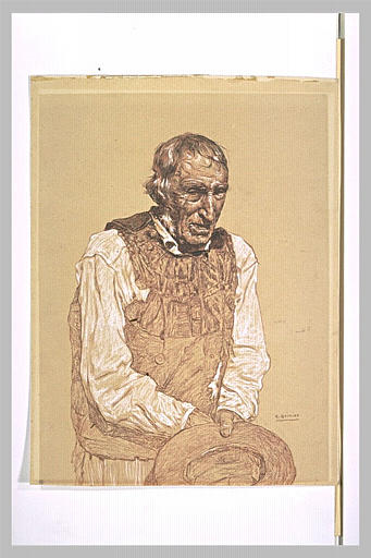 Vieux paysan breton tenant son chapeau devant lui_0