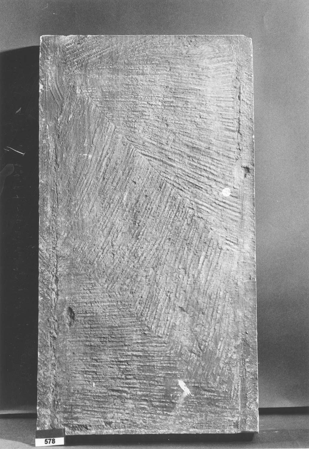 Moulage de façon de taille de pierre : taille à longues parallèles inclinées