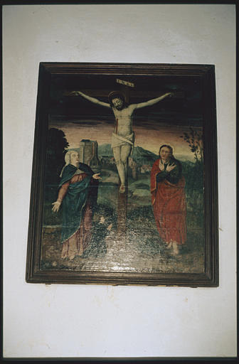 Tableau : 'Le Christ en croix avec la Vierge et saint Jean, ainsi qu'un donateur', donateur à une échelle plus petite, à genoux mains jointes, paysage avec vue de ville fortifiée ; après restauration