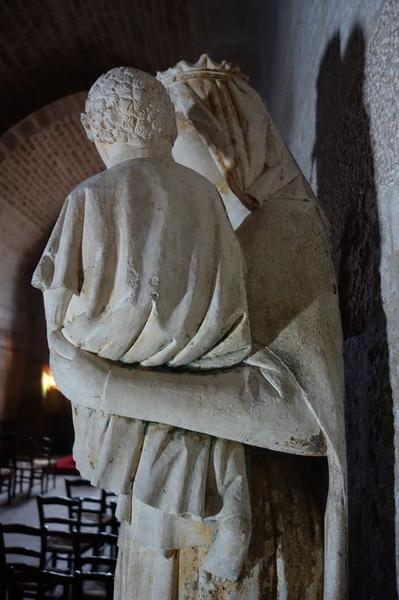 groupe sculpté : Vierge à l'enfant avec un donateur, détail