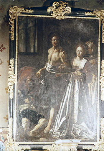 Tableau, cadre : 'La remise de la tête de saint Jean-Baptiste à Salomé', huile sur toile et son cadre en bois doré et noirci à décor de coquilles et éléments végétaux