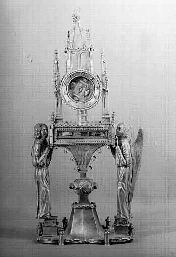 Reliquaire en argent à cylindre horizontal et porté par deux anges