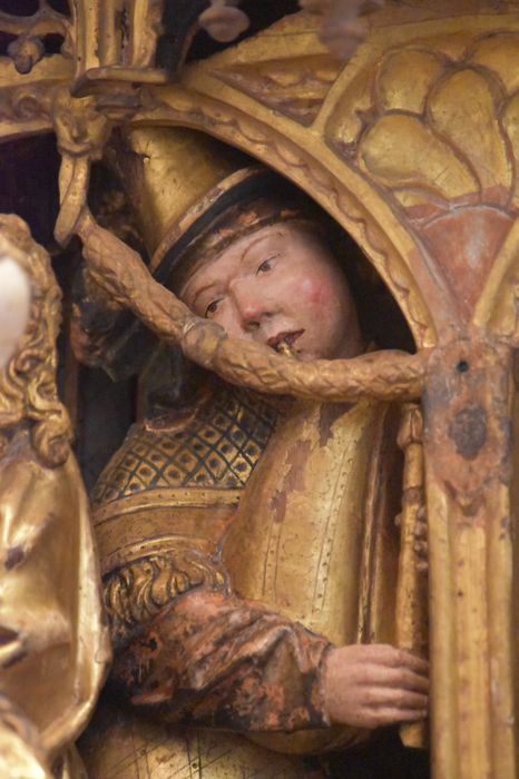 retable : scènes de la vie de la Vierge, l'Arbre de Jessé, détail : visage d’un joueur de musique dans la scène de la Nativité
