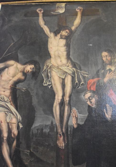 tableau : Crucifixion entre saint Sébastien, saint Jacques et un abbé, vue partielle