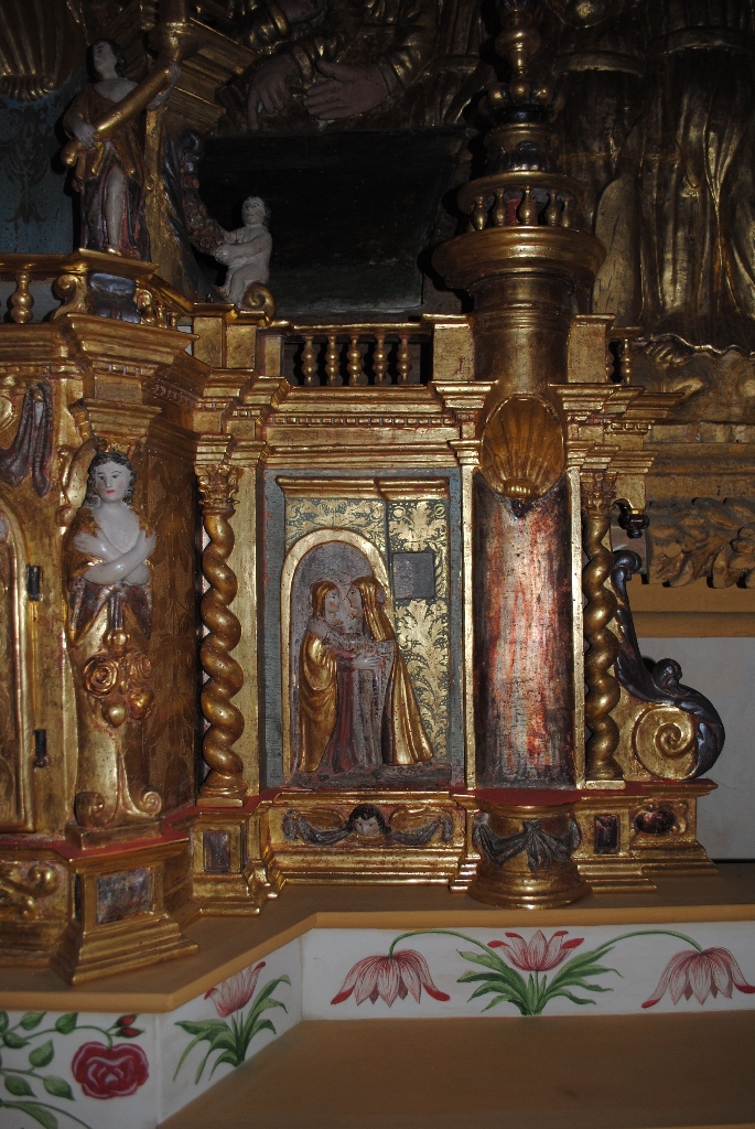 tabernacle et deux bas-reliefs : Annonciation et Visitation