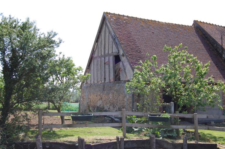 Grange-étable nord, vue de détail du pan de bois du mur-pignon ouest.