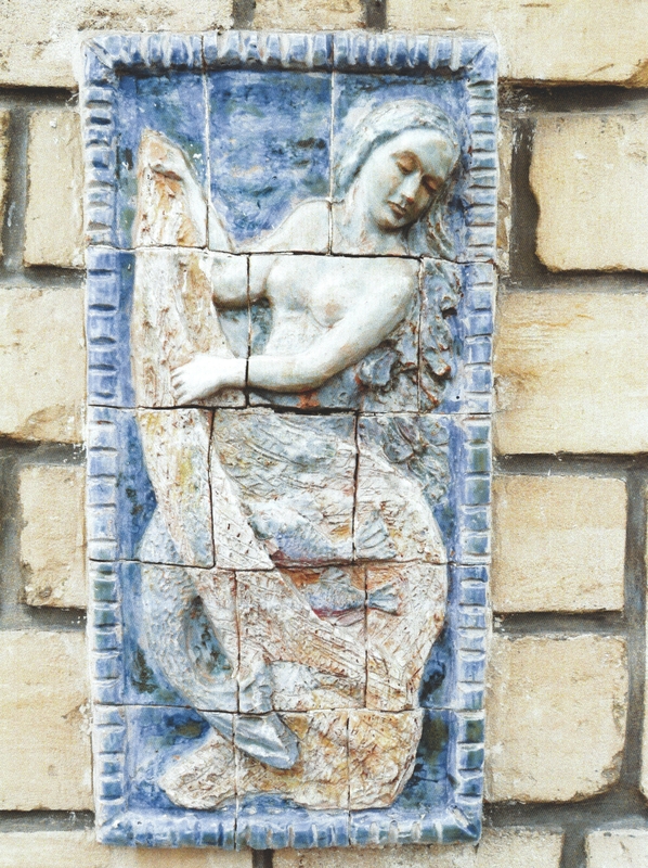 Sirène tenant un filet.