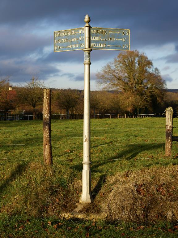 Poteau indicateur de cocher, en fonte.