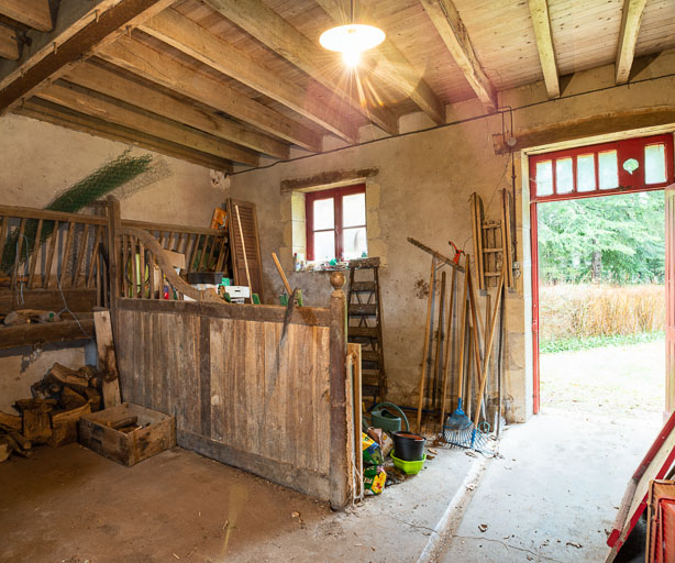 Vue intérieure de l'ancienne écurie au rez-de-chaussée.