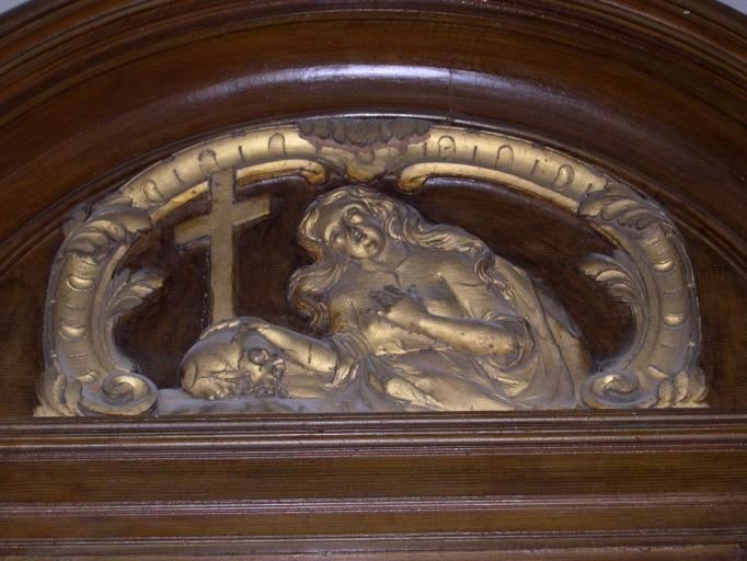 Le cartouche représentant sainte Madeleine sur le confessionnal nord.