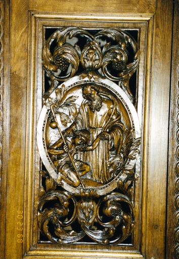 Vue de détail du décor d'une porte : l'enfant prodigue.