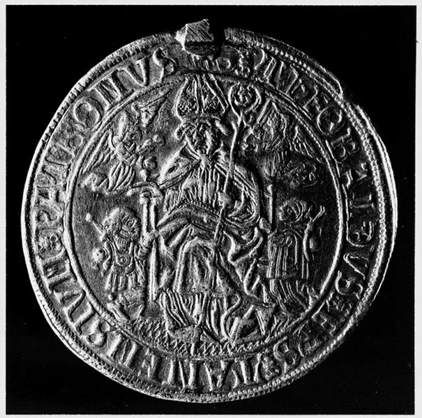 Pièce d'un taler : revers : Saint Thiébaut flanqué des deux pèlerins agenouillés à ses pieds et de deux anges volant.