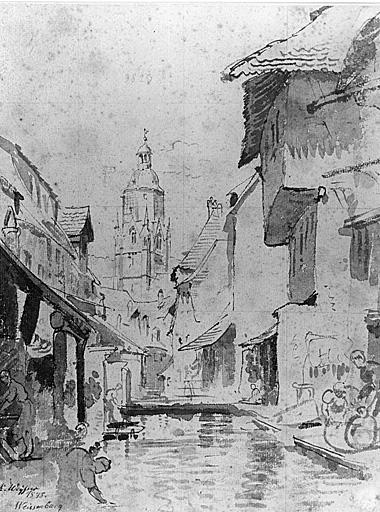 Vue d'un groupe de maisons donnant sur l'eau.