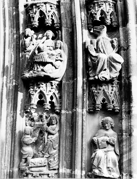 Portail ouest, voussure V, rouleaux 3, 4 et 5, reliefs V49, V50, V73 et V74 : Naissance de Caïn, travaux d'Adam et Eve; Evangélistes Saint Jean et Saint Matthieu.