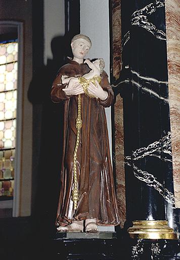 Vue d'ensemble de face d'une statue de saint Antoine de Padoue (autel secondaire de saint Jean Népomucène).