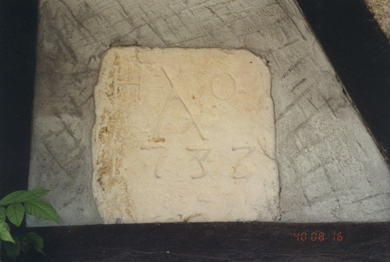 Pierre gravée des initiales ' H. O. '..