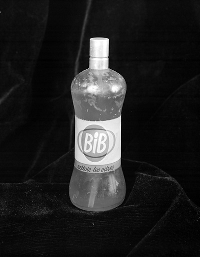 Bouteille en verre plastifiée.