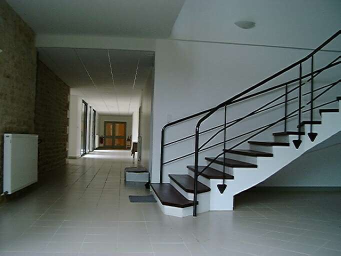 Logis, intérieur, rez-de-chaussée, espace de liaison entre l'ancien logis et la partie hôtellerie, vue prise de l'est vers l'ouest.