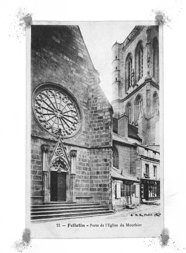 Vue partielle prise depuis la Grande Rue et montrant le portail du transept nord et l'élévation sud du clocher.