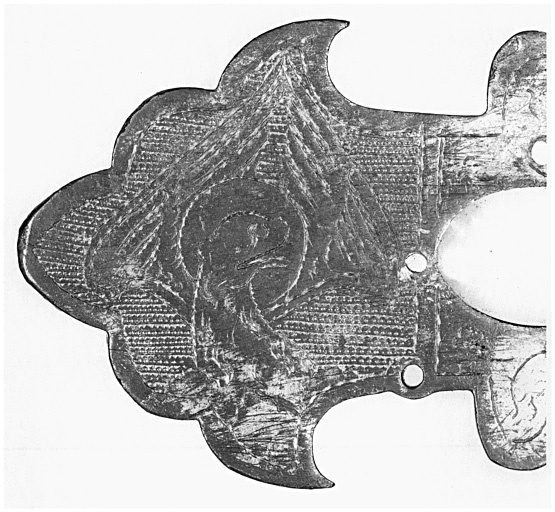 Détail de l'extrémité du bras de la croix, au revers : lion de saint Marc.