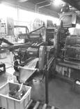 Ligne de fabrication des couteaux monoblocs : partie arrière du laminoir.