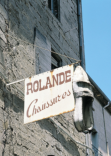 Enseigne de marchand de chaussures, première moitié du 20e siècle.