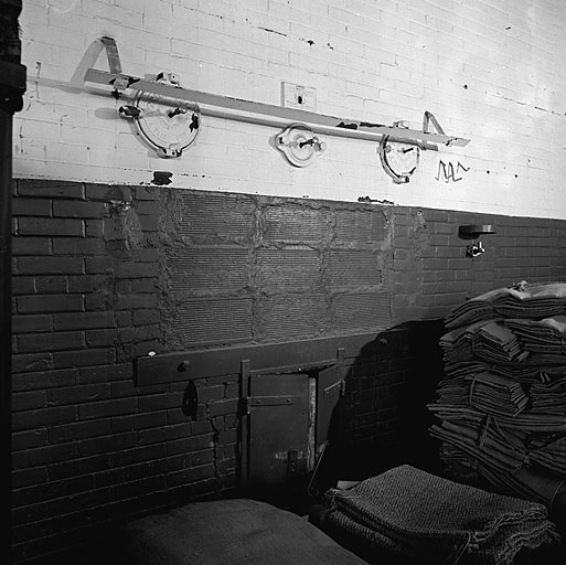 Bâtiment 003. Rez-de-chaussée. Local 02. Façade d'un des anciens fours à pain (la gueule a été murée en briques creuses).