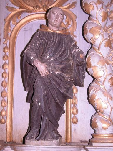 Statuette de moine (saint Antoine de Padoue ?) sur l'aile gauche du tabernacle.