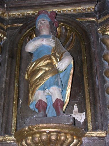 Statuette de saint légionnaire, sur le pan coupé droit de l'armoire eucharistique.