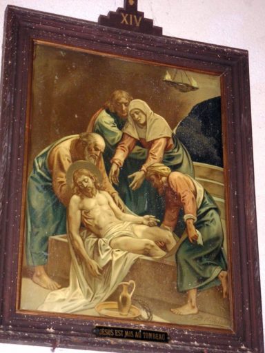 Station XIV : Jésus est mis au tombeau.