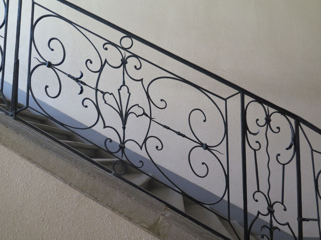 Escalier. Détail de la rampe en fer forgé