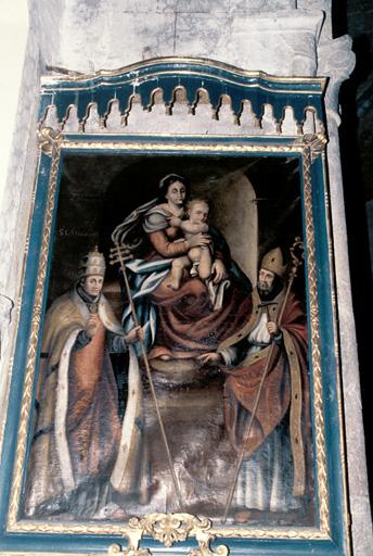 Nef, deuxième travée, mur est, autel Saint-Eloi, tableau 17e siècle : Vierge à l'enfant, Saint-Clément et Saint-Eloi.