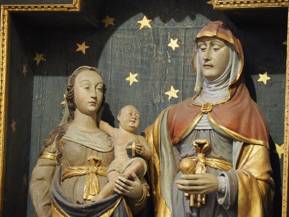 7 statues : Vierge à l'Enfant, Sainte Anne, Saint Joachim, Saint Joseph, Sainte Barbe, Sainte Marguerite, Saint évêque ; détail panneau central