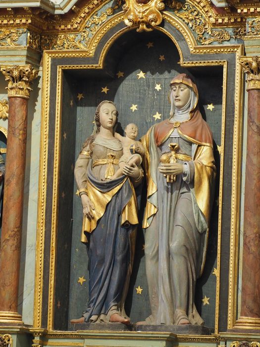 7 statues : Vierge à l'Enfant, Sainte Anne, Saint Joachim, Saint Joseph, Sainte Barbe, Sainte Marguerite, Saint évêque ; détail panneau central