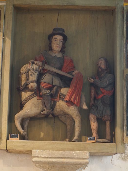 groupe sculpté, niche à volets : Saint Martin et le Pauvre, détail du volet de droite - © Ministère de la Culture (France), Conservation des antiquités et des objets d’art du Finistère, tous droits réservés