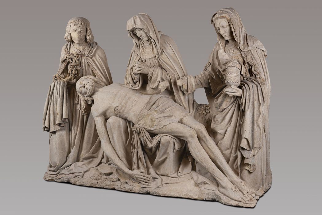 groupe sculpté dite Pietà de Saint-Marcoul : le Christ pleuré par la Vierge, saint Jean et Madeleine - © Ministère de la Culture (France), Musée Saint-Remi de Reims - Tous droits réservés