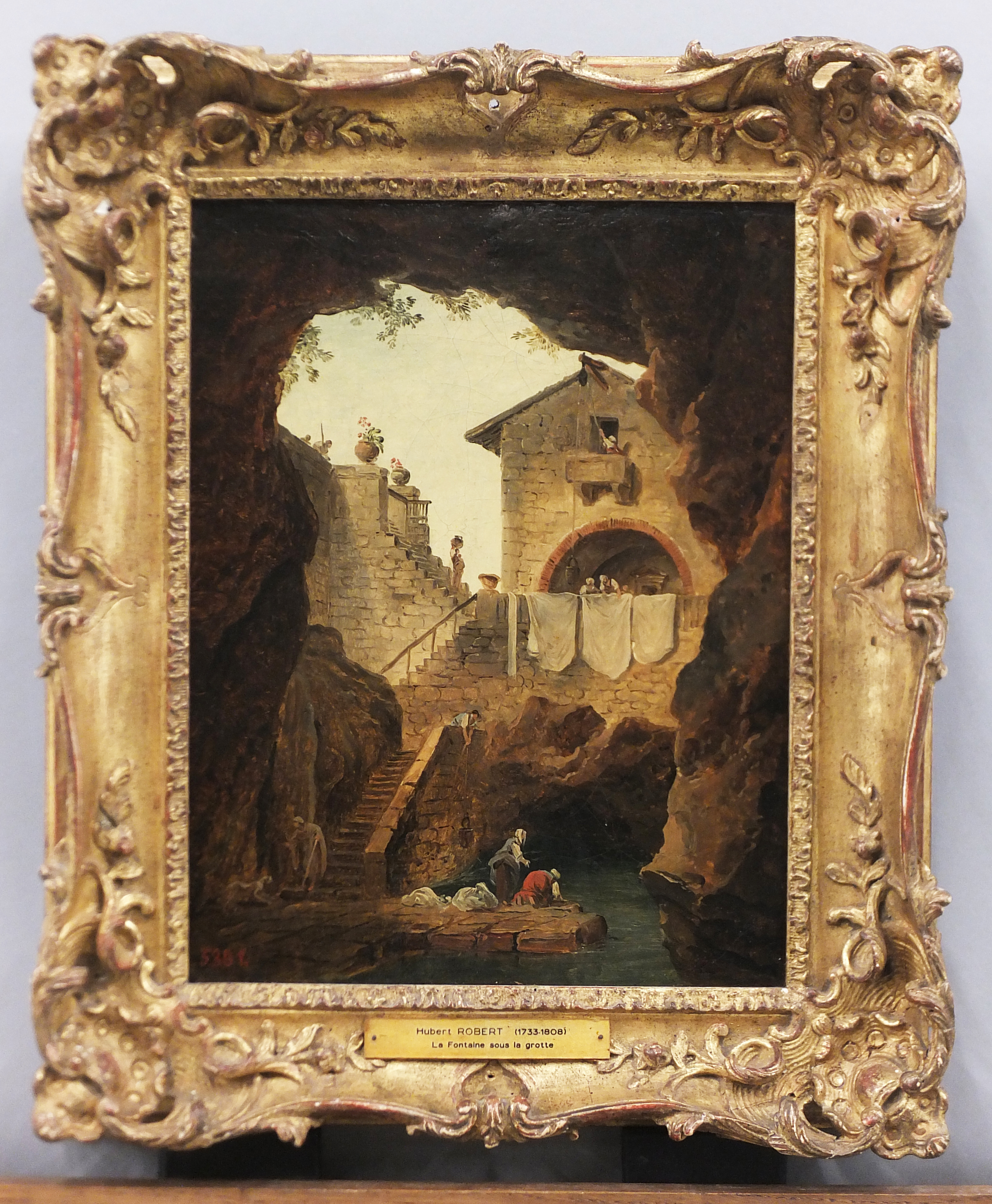 Lavandières. La fontaine sous la grotte